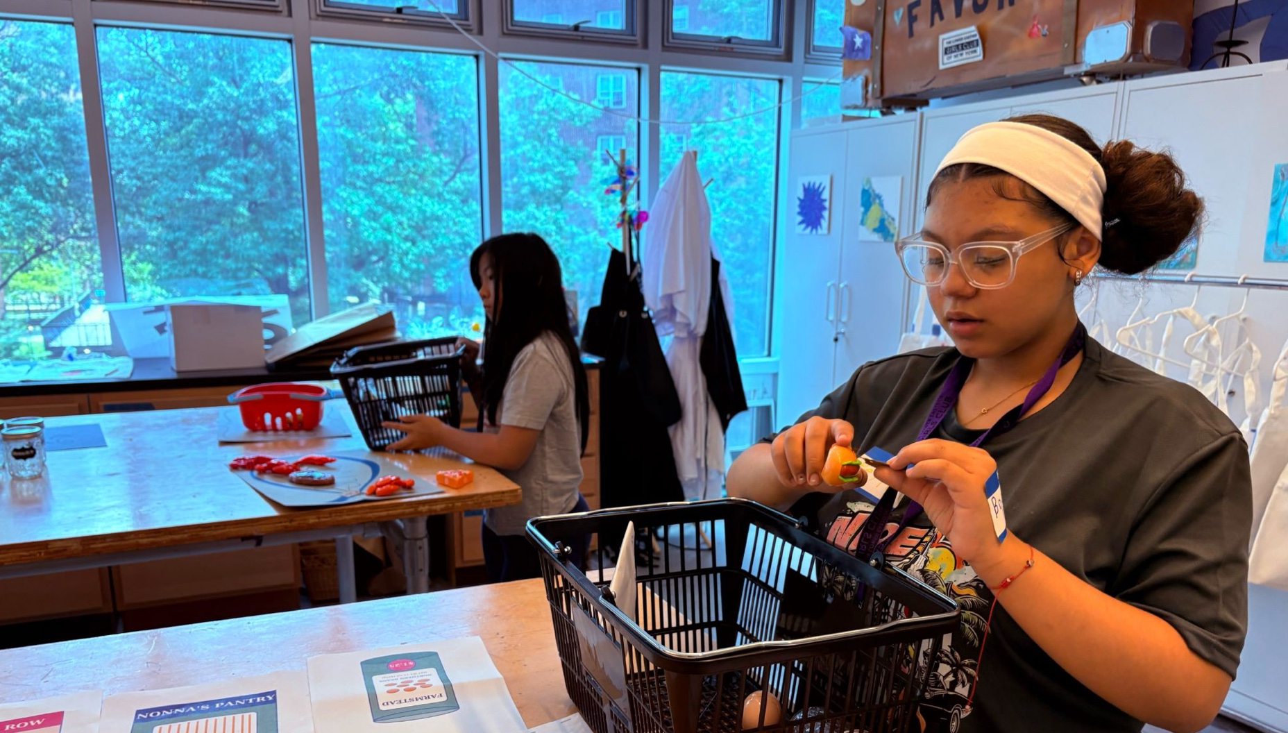 Students exploring math with hands-on materials at a Math Cases workshop.